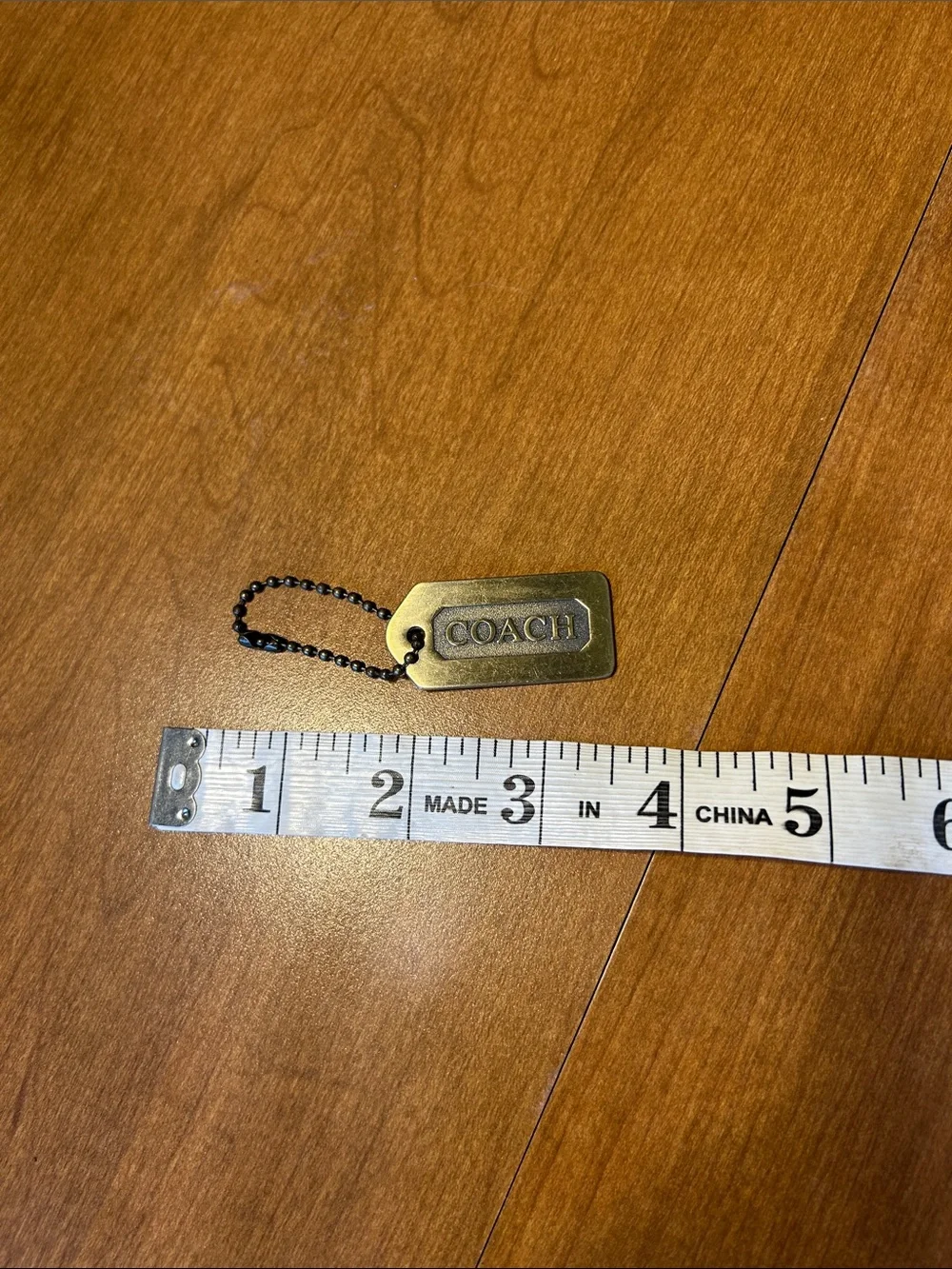 Coach Brass Dog Tag Keychain in Antique Gold with Black Chain